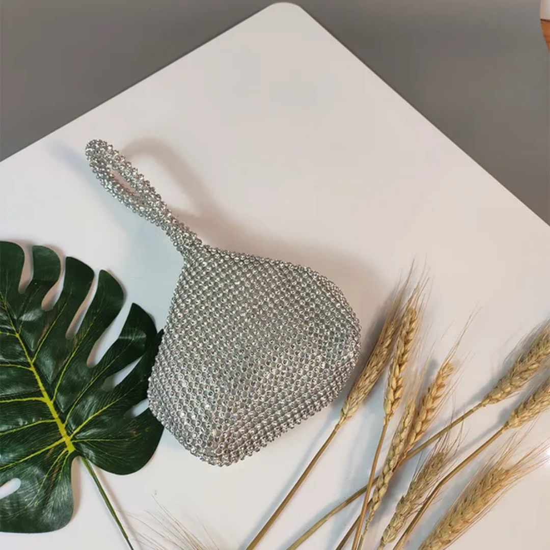 Silver Steal The Spotlight Crystal Knot Bag: rhinestone-studded slouchy clutch with a knotted strap.