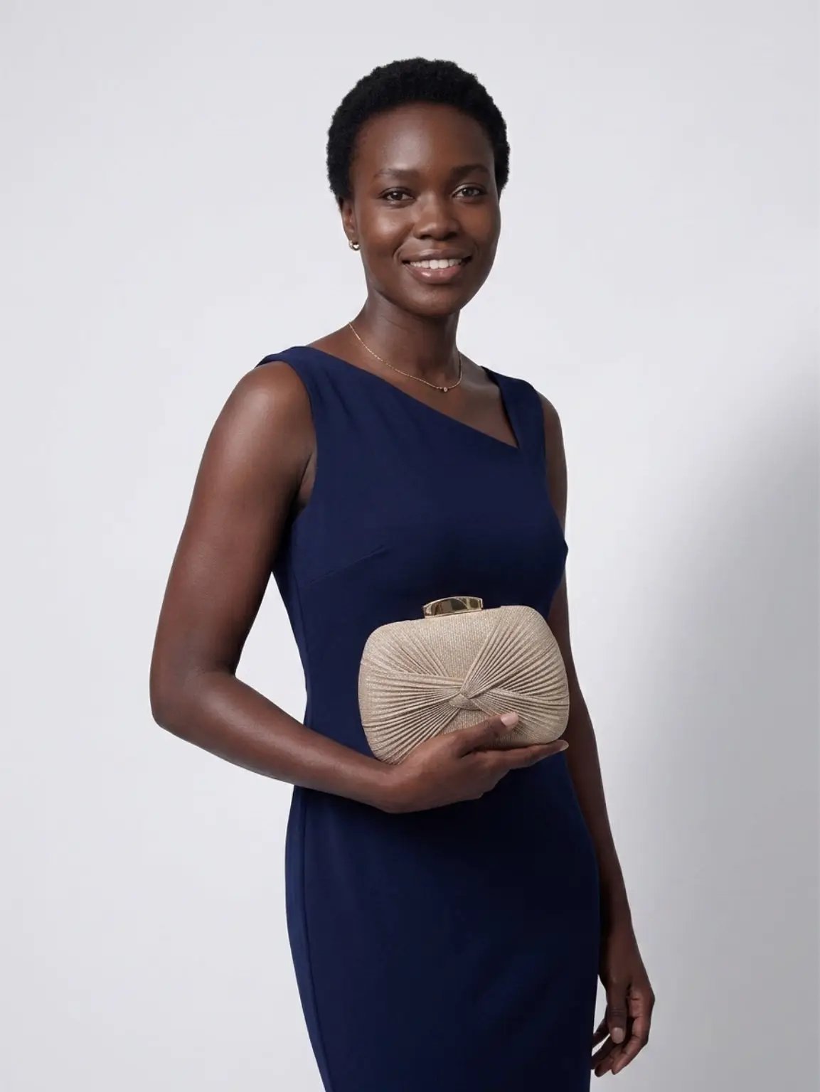 Champagne Gold Pleated Hardcase Clutch Bag by Clarissas Boutique London