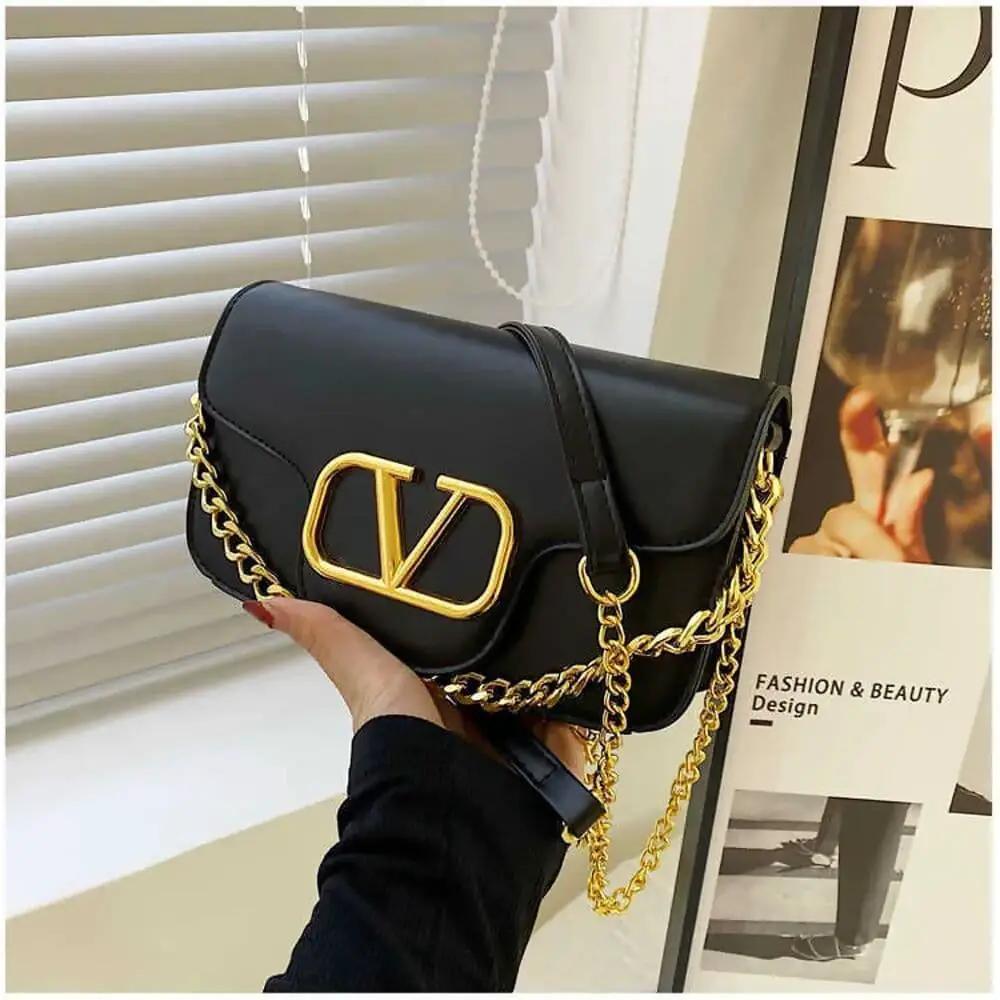 Black - V BUCKLE CLUTCH BAG- by Clarissas Boutique London